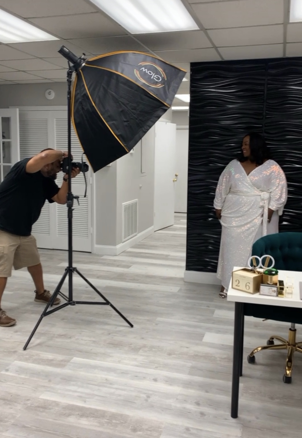 Portrait photography session with studio lighting and a backdrop