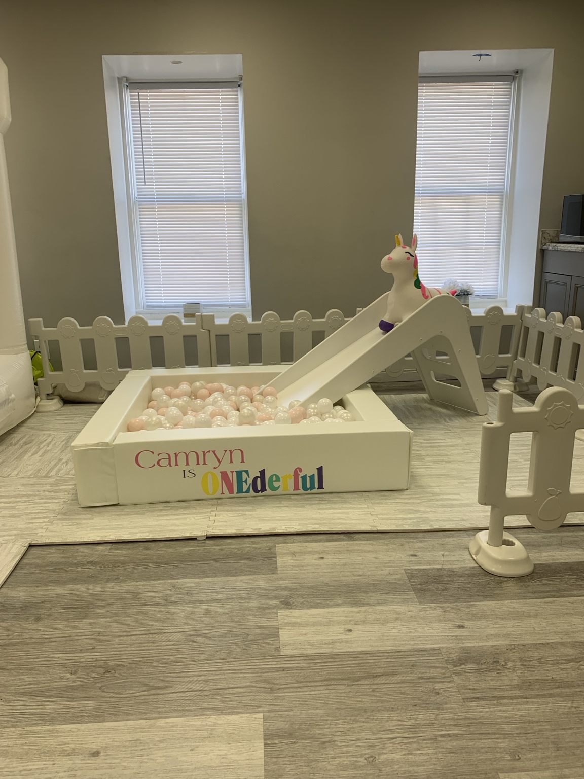 White toddler play area with ball pit and slide